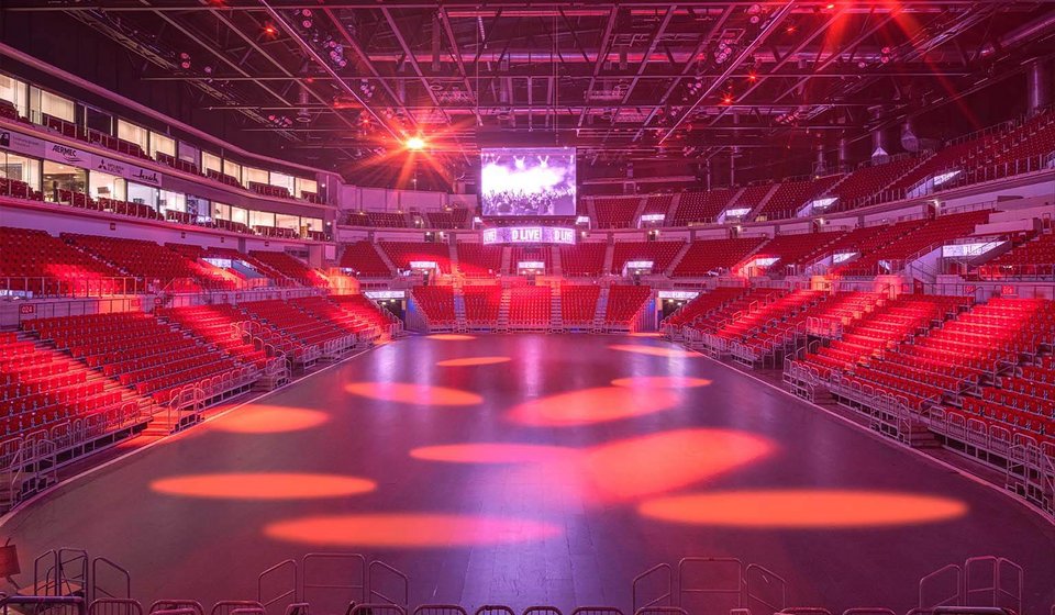 The interior of PSD BANK DOME is illuminated in red. The video cube lights up on the ceiling in white. 